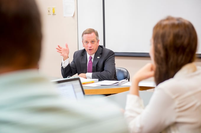 Dean addressing students