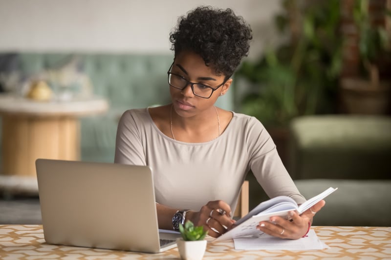 Woman preparing using her laptop to study for the LSAT