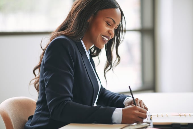 Black, female lawyer working at a desk
