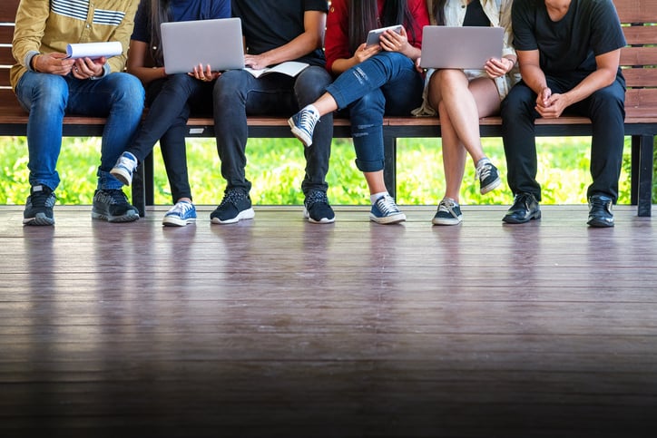 college students on a bench