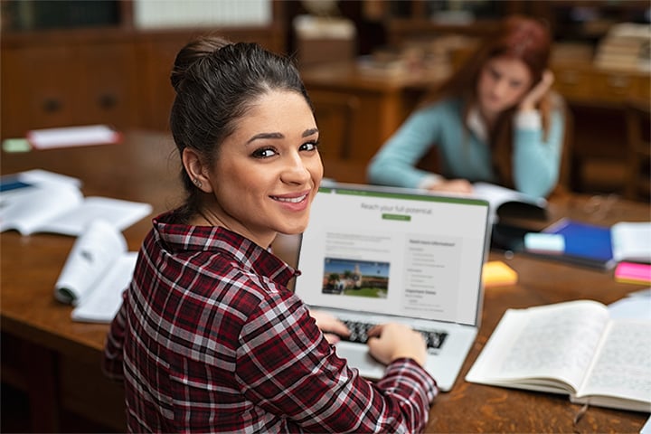 Woman applying to law school on a laptop