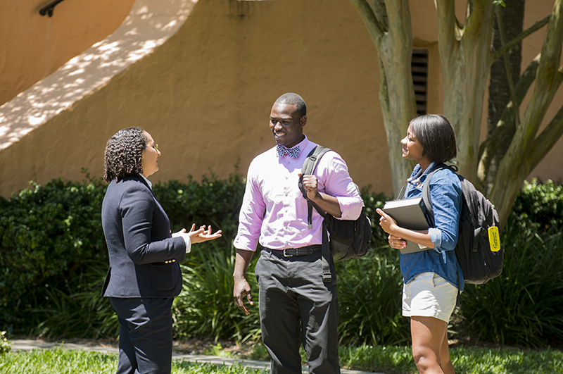 Students talking with law professor