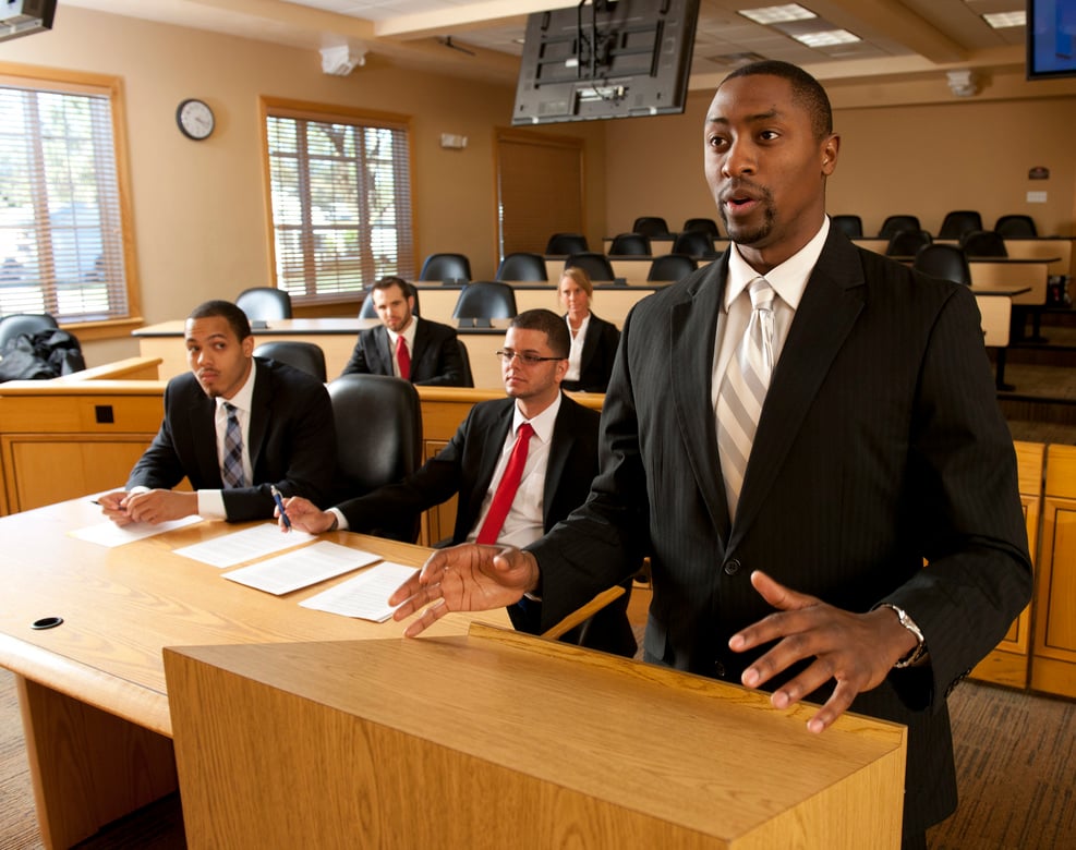 4 men and a woman in a Stetson classroom