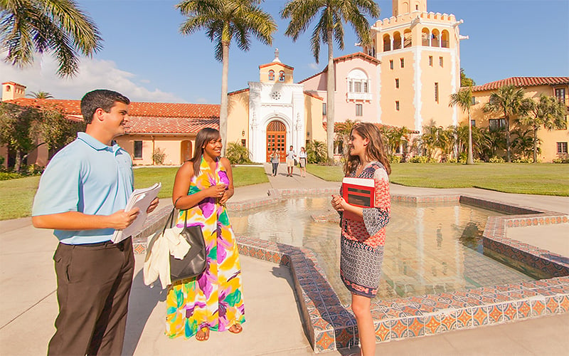 Group of diverse Stetson Law students having a conversation in the plaza.