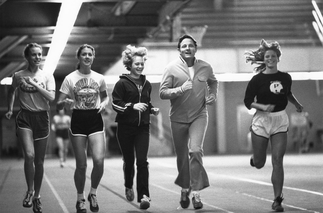 Senator Birch Bayh exercises with Title IX athletes at Purdue University in the 1970s.